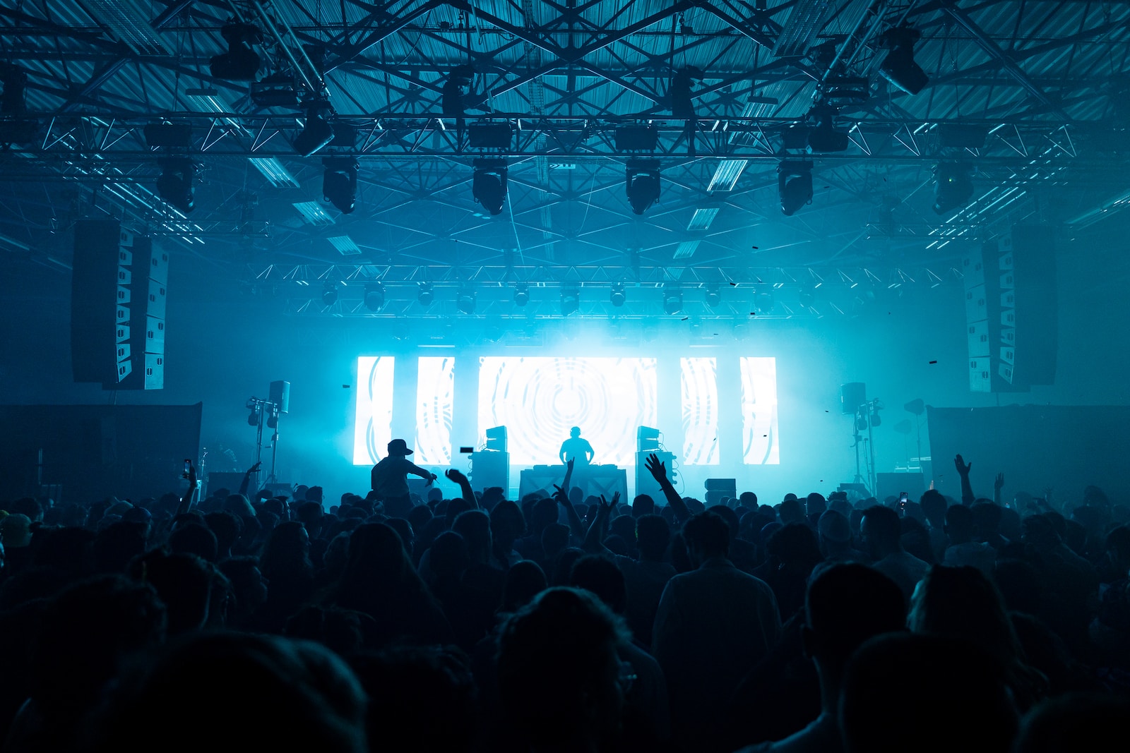 a group of people standing on top of a stage