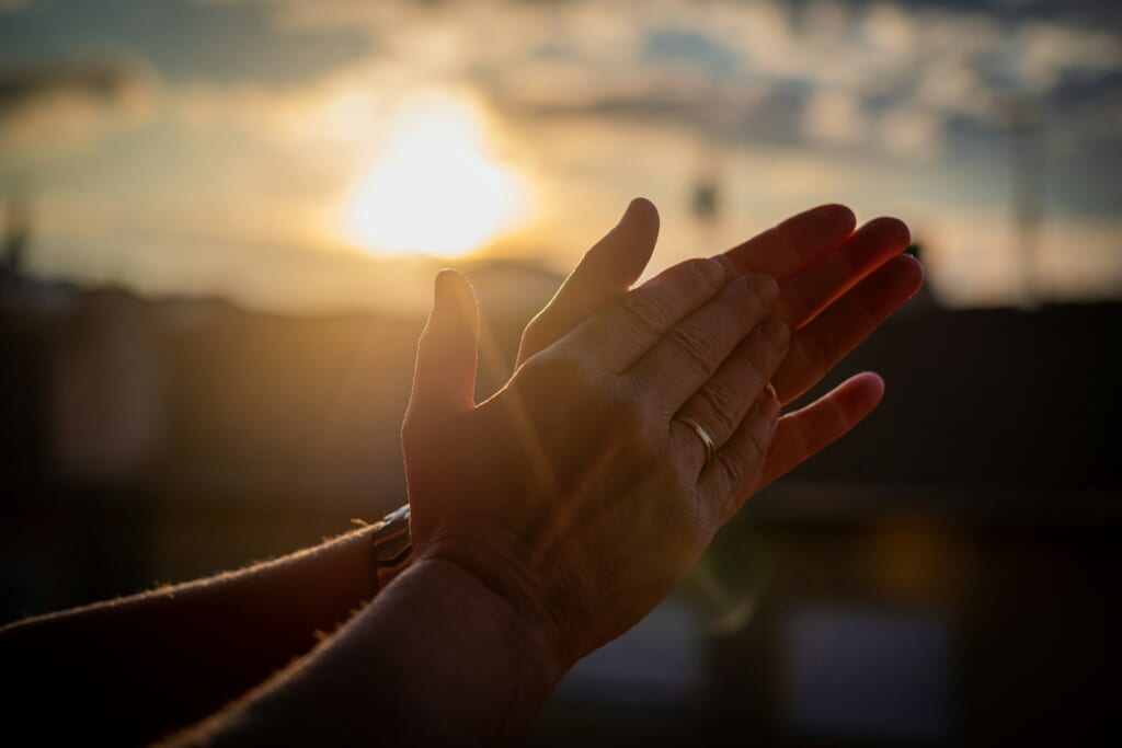 persons left hand with silver ring