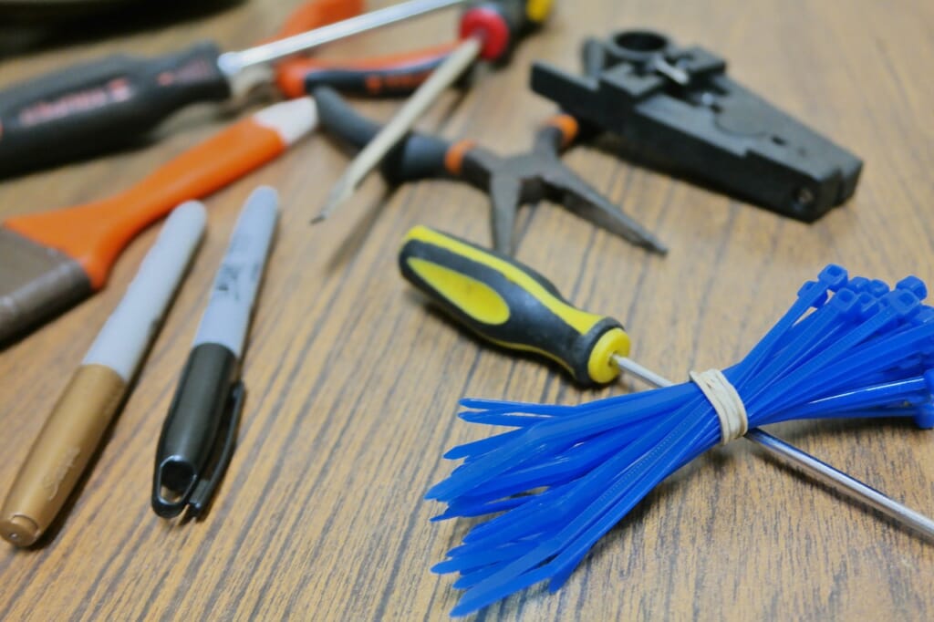 tweezers, screwdriver, brush