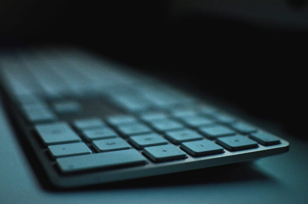 selective focus photography of Apple Magic Keyboard on table